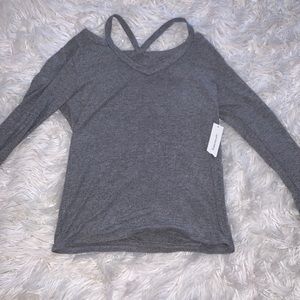 Grey long sleeve w cute shoulder slits. Never worn